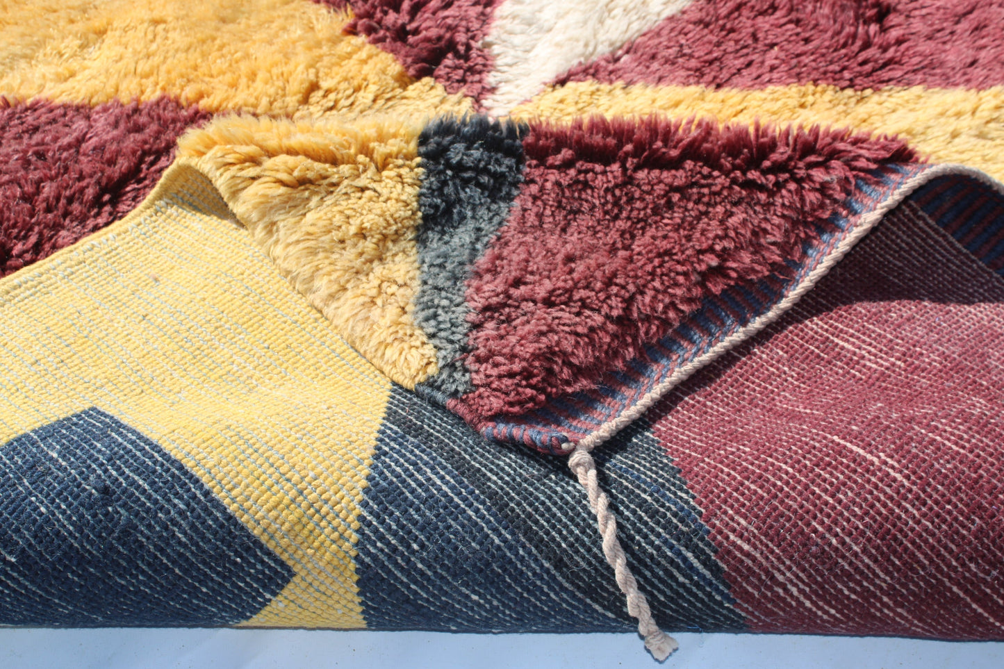 Beni Ourain rugs originate from the Atlas Mountains of Morocco and are characterized by their distinctive, neutral-toned, and geometric designs. These handwoven rugs often feature a plush pile and are made by the Berber tribes, size is 280x177 cm