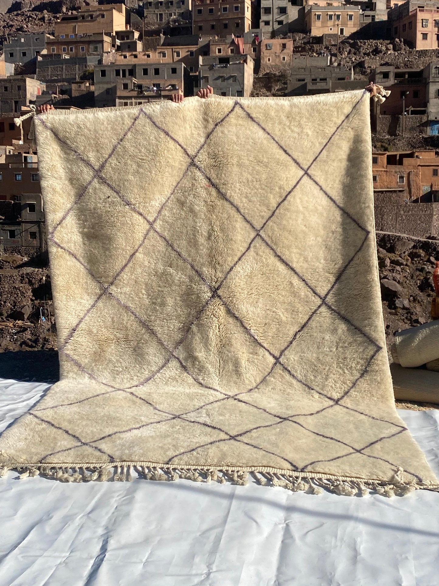 Beni Ourain rugs originate from the Atlas Mountains of Morocco and are characterized by their distinctive, neutral-toned, and geometric designs. These handwoven rugs often feature a plush pile and are made by the Berber tribes,  size is 310x200 cm