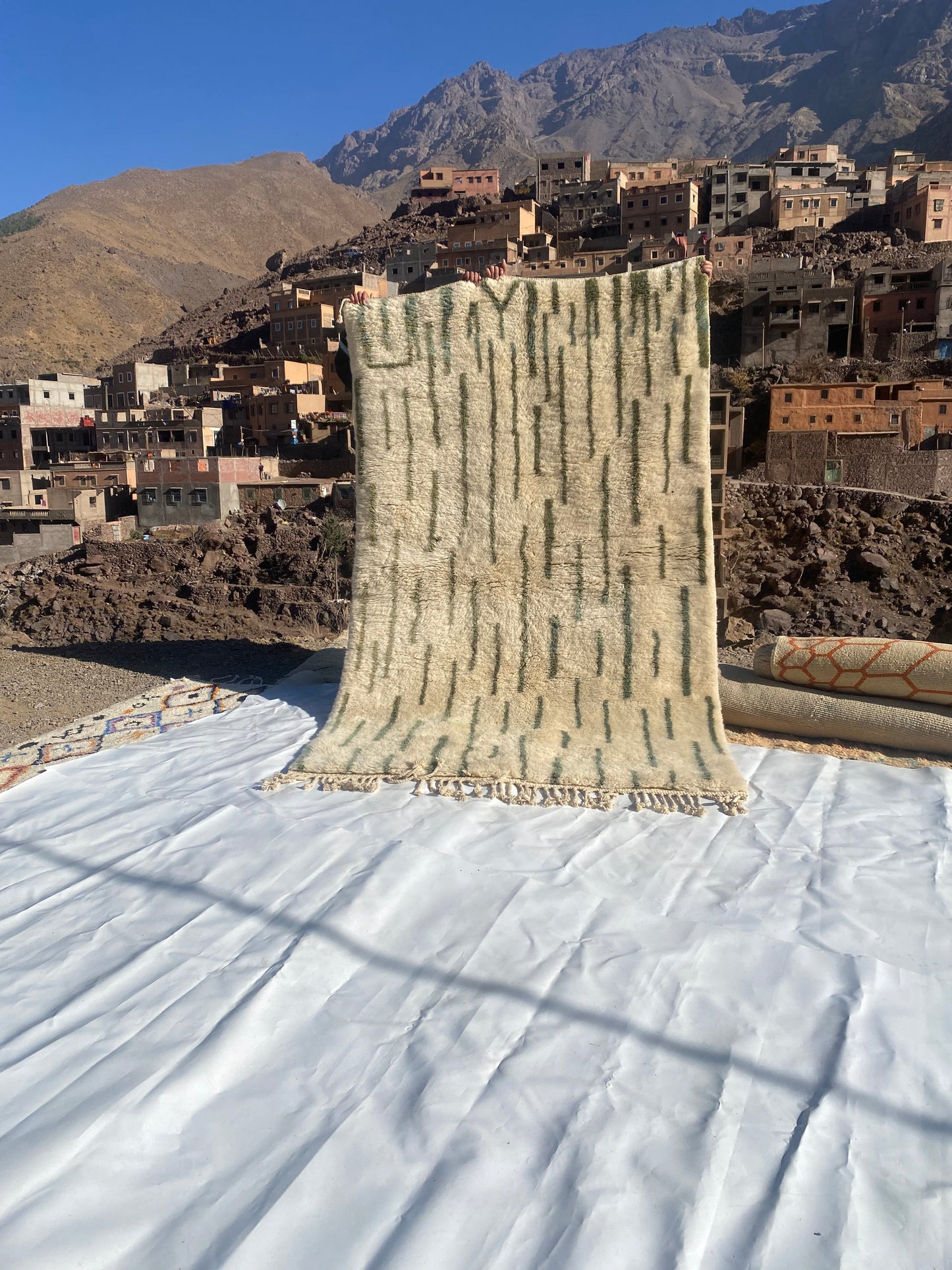 Beni Ourain rugs originate from the Atlas Mountains of Morocco and are characterized by their distinctive, neutral-toned, and geometric designs. These handwoven rugs often feature a plush pile and are made by the Berber tribes,  size is 255x155 cm