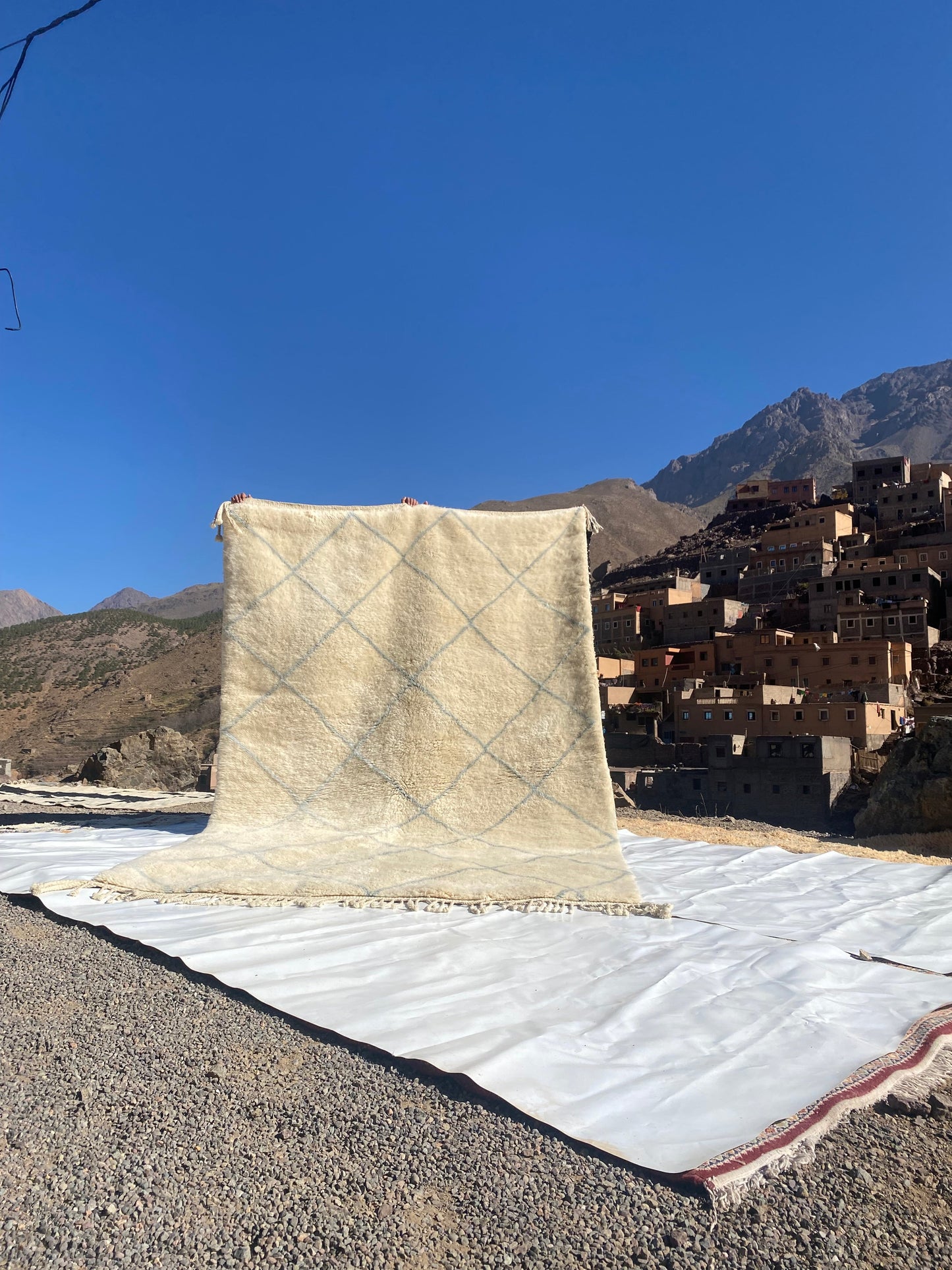 Beni Ourain rugs originate from the Atlas Mountains of Morocco and are characterized by their distinctive, neutral-toned, and geometric designs. These handwoven rugs often feature a plush pile and are made by the Berber tribes,  size is 312x200 cm