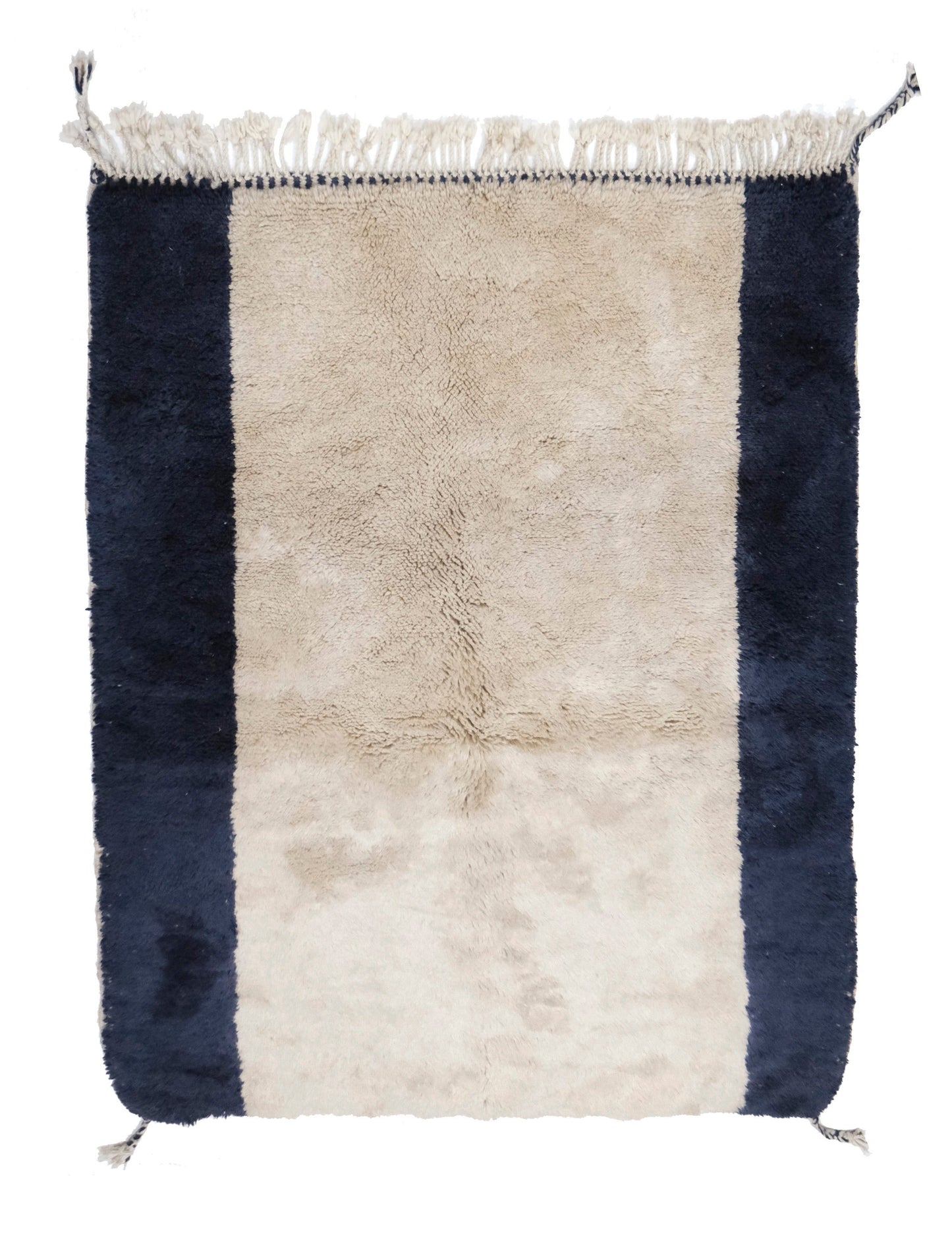Plush wool rug featuring a wide cream center framed by thick navy blue vertical border stripes, finished with a top cream fringe and braided corner tassels, displayed on a white background.