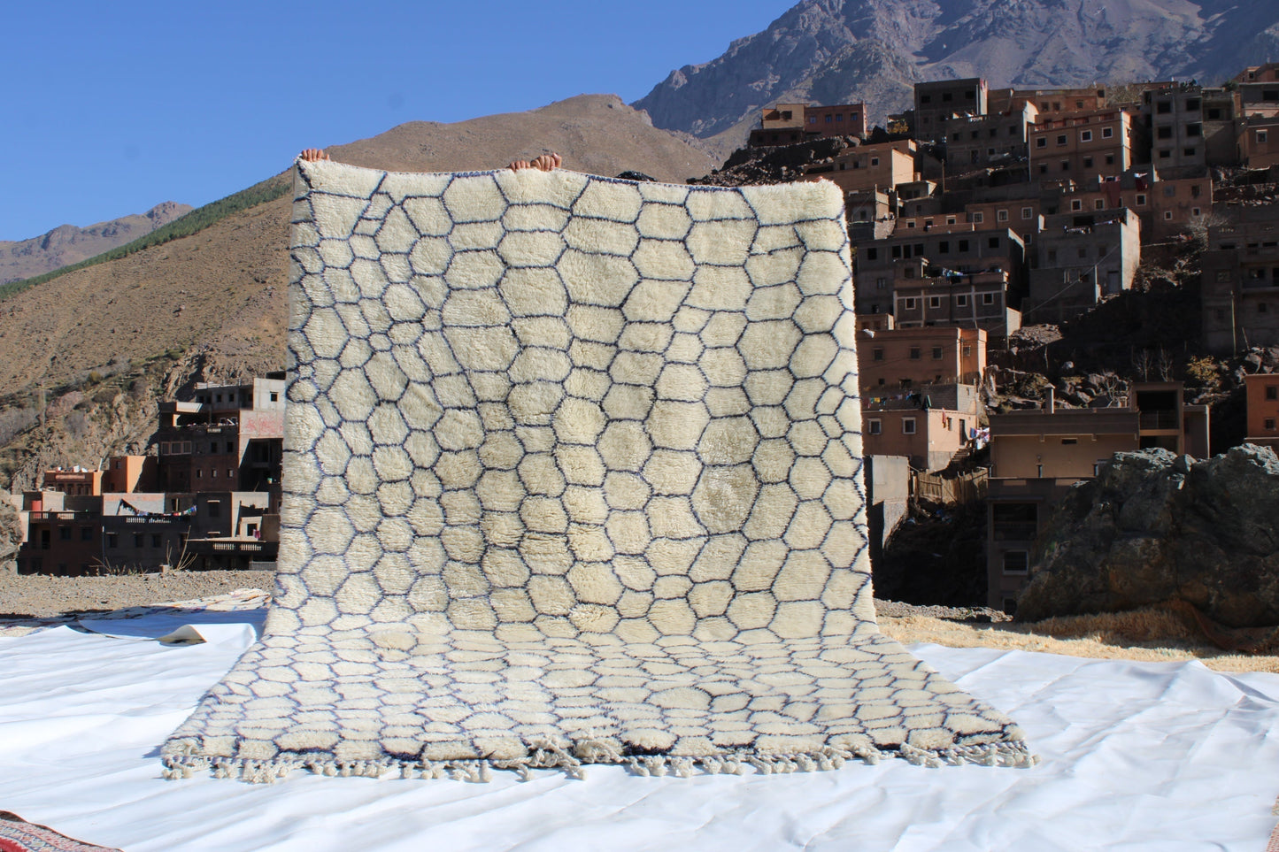 Beni Ourain rugs originate from the Atlas Mountains of Morocco and are characterized by their distinctive, neutral-toned, and geometric designs. These handwoven rugs often feature a plush pile and are made by the Berber tribes,  size is 320x206 cm