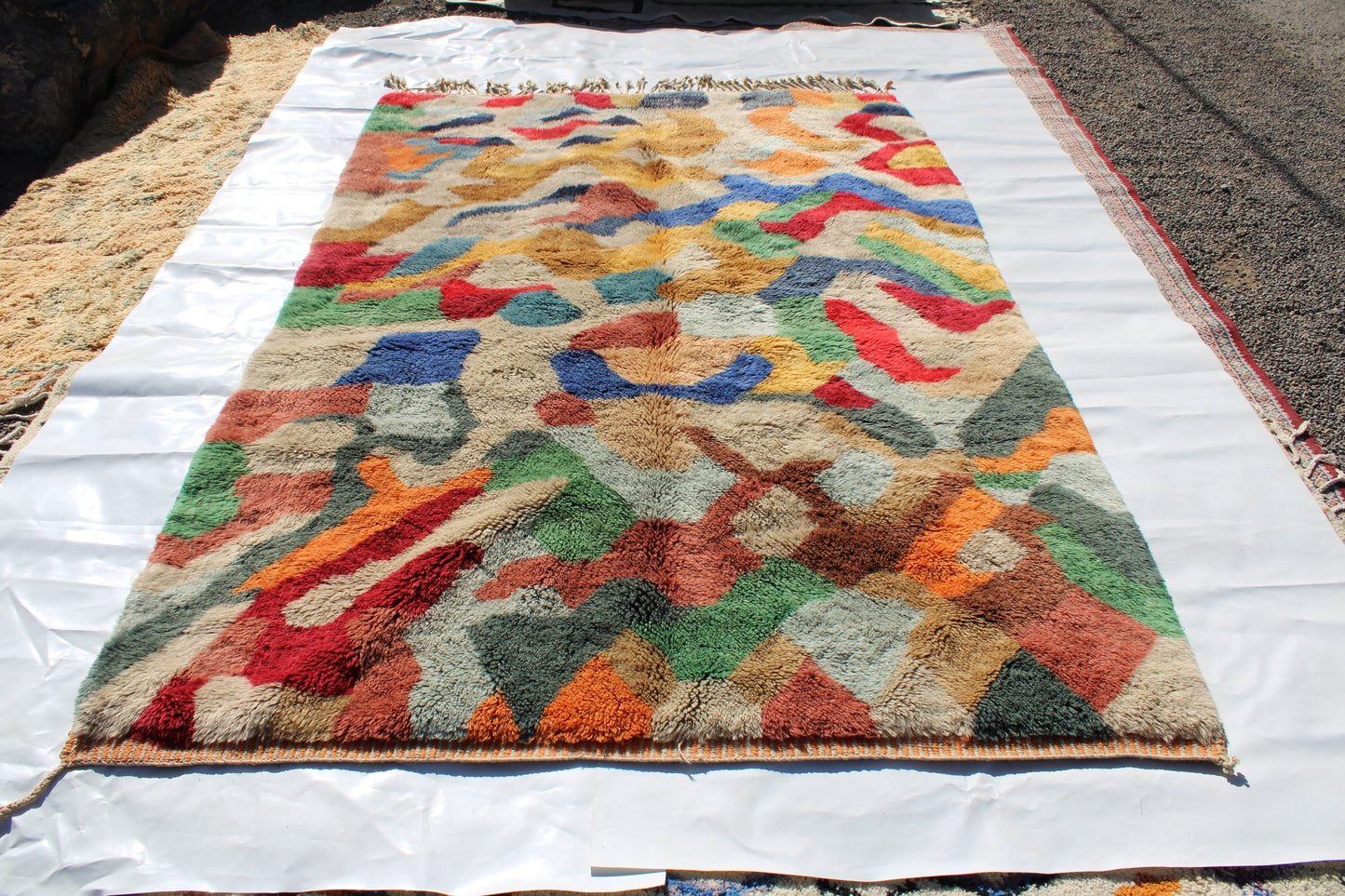 Beni Ourain rugs originate from the Atlas Mountains of Morocco and are characterized by their distinctive, neutral-toned, and geometric designs. These handwoven rugs often feature a plush pile and are made by the Berber tribes,  size is 300x200 cm