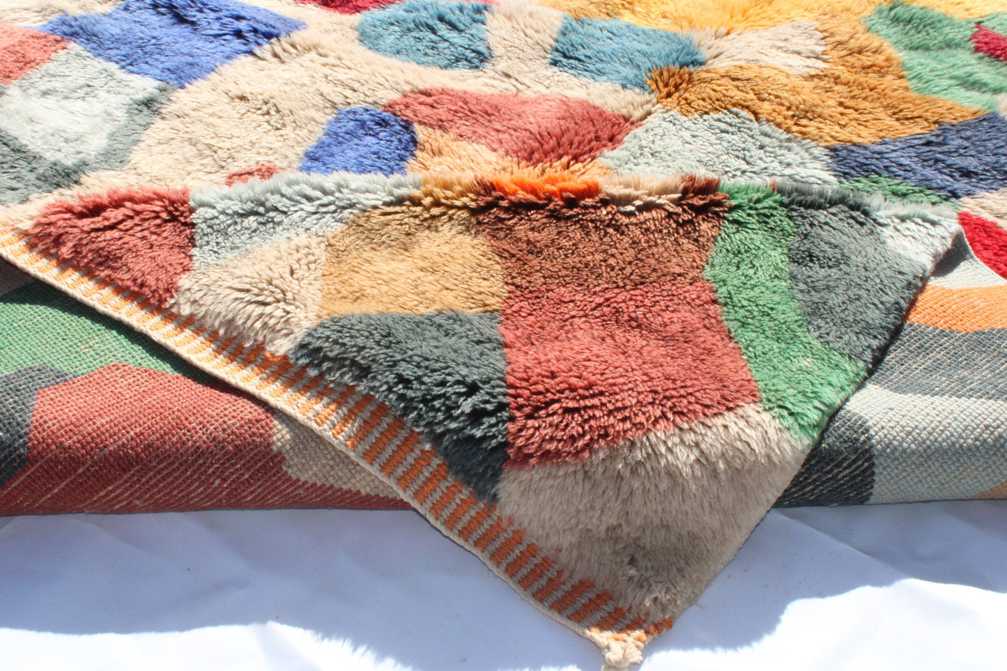 Beni Ourain rugs originate from the Atlas Mountains of Morocco and are characterized by their distinctive, neutral-toned, and geometric designs. These handwoven rugs often feature a plush pile and are made by the Berber tribes,  size is 300x200 cm