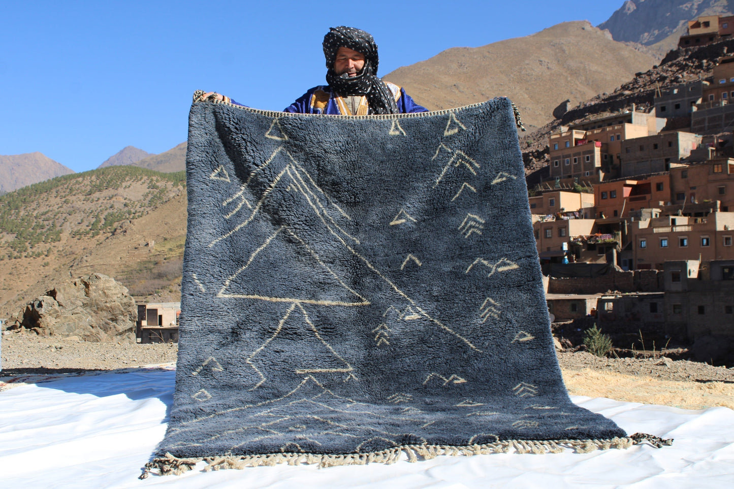 Beni Ourain rugs originate from the Atlas Mountains of Morocco and are characterized by their distinctive, neutral-toned, and geometric designs. These handwoven rugs often feature a plush pile and are made by the Berber tribes,  size is 210x160 cm