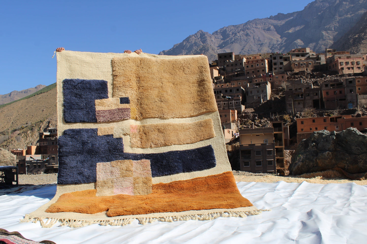 Beni Ourain rugs originate from the Atlas Mountains of Morocco and are characterized by their distinctive, neutral-toned, and geometric designs. These handwoven rugs often feature a plush pile and are made by the Berber tribes,  size is 260x165 cm