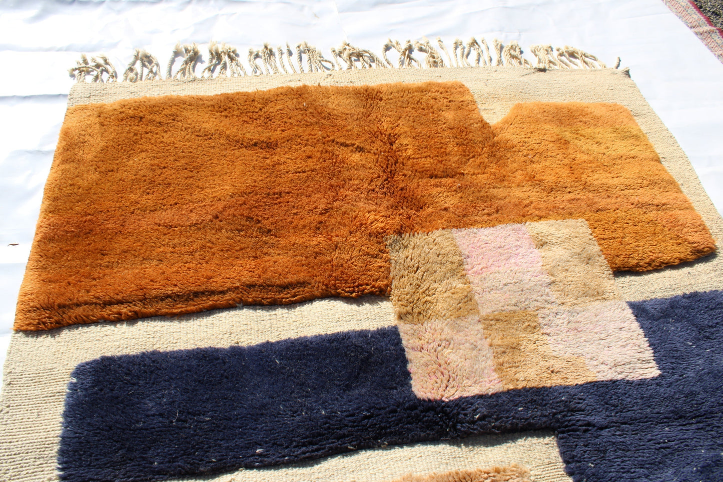 Beni Ourain rugs originate from the Atlas Mountains of Morocco and are characterized by their distinctive, neutral-toned, and geometric designs. These handwoven rugs often feature a plush pile and are made by the Berber tribes,  size is 260x165 cm