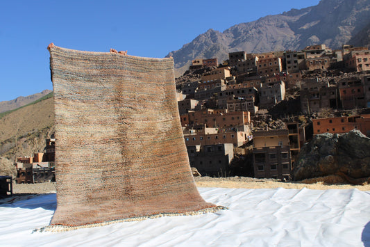 Beni Ourain rugs originate from the Atlas Mountains of Morocco and are characterized by their distinctive, neutral-toned, and geometric designs. These handwoven rugs often feature a plush pile and are made by the Berber tribes,  size is 250x155 cm