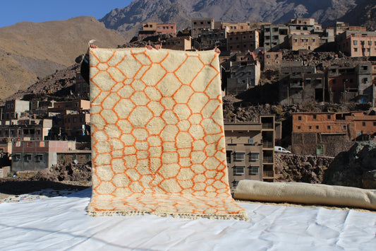 Beni Ourain rugs originate from the Atlas Mountains of Morocco and are characterized by their distinctive, neutral-toned, and geometric designs. These handwoven rugs often feature a plush pile and are made by the Berber tribes,  size is 255x155 cm