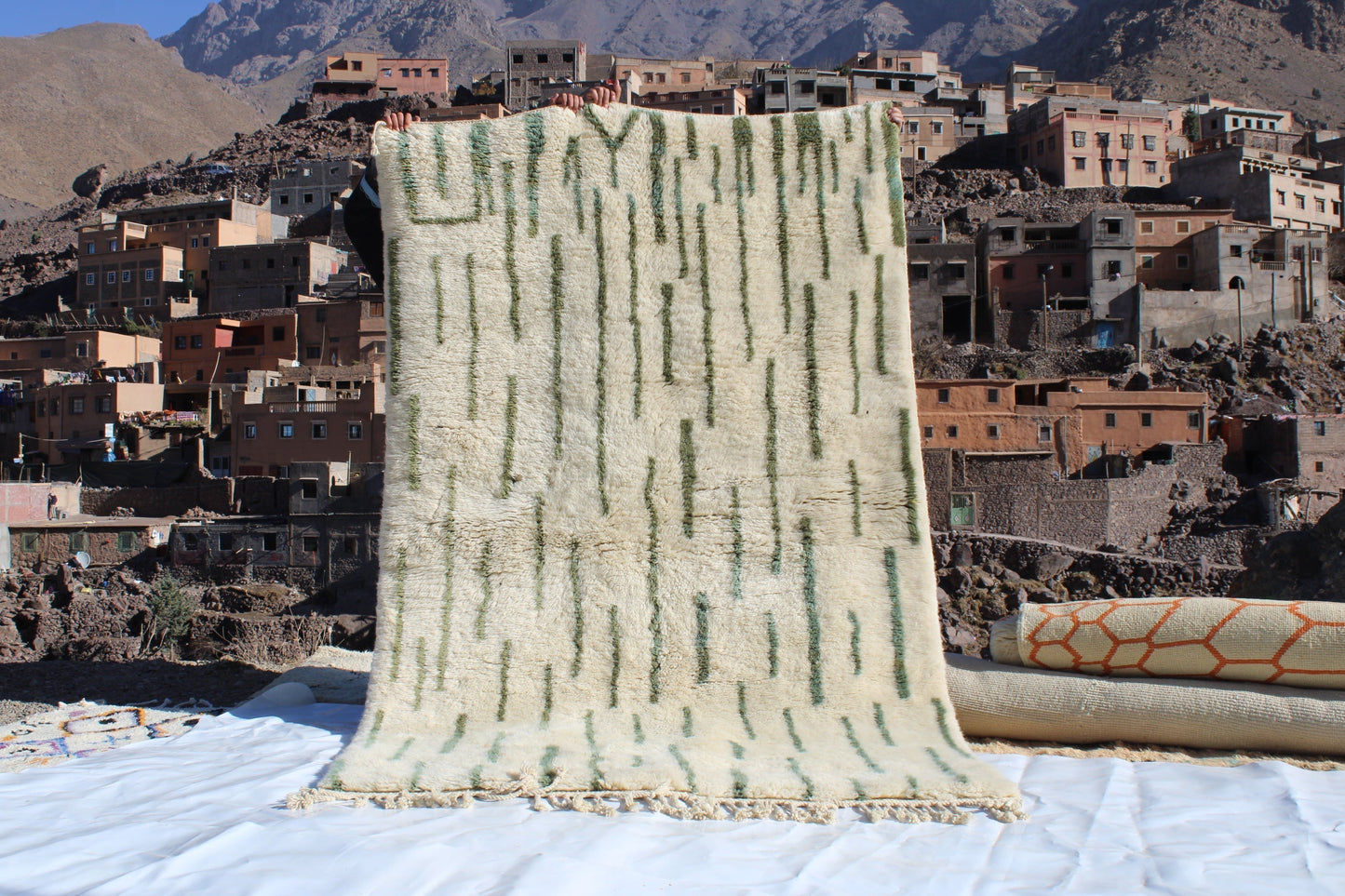 Beni Ourain rugs originate from the Atlas Mountains of Morocco and are characterized by their distinctive, neutral-toned, and geometric designs. These handwoven rugs often feature a plush pile and are made by the Berber tribes,  size is 255x155 cm