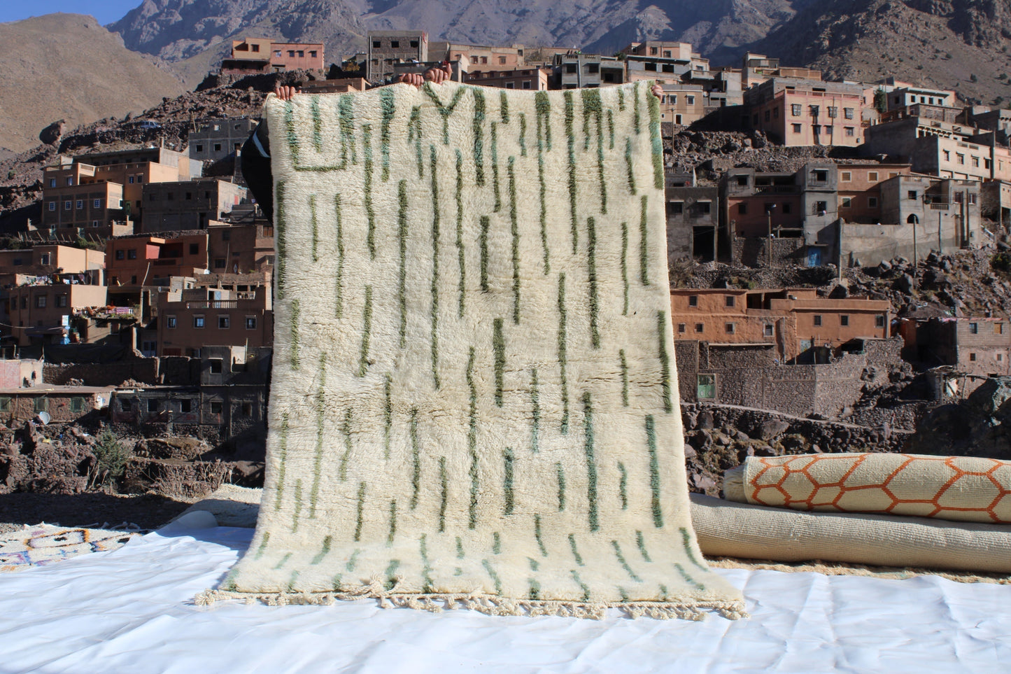 Beni Ourain rugs originate from the Atlas Mountains of Morocco and are characterized by their distinctive, neutral-toned, and geometric designs. These handwoven rugs often feature a plush pile and are made by the Berber tribes,  size is 255x155 cm