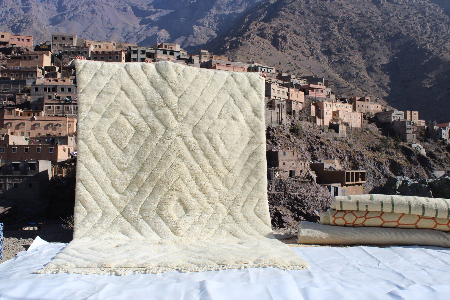 Beni Ourain rugs originate from the Atlas Mountains of Morocco and are characterized by their distinctive, neutral-toned, and geometric designs. These handwoven rugs often feature a plush pile and are made by the Berber tribes,  size is 300x200 cm