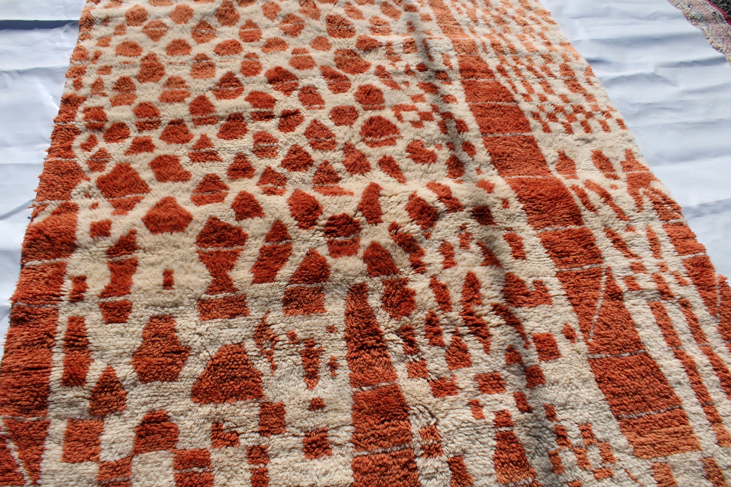 Beni Ourain rugs originate from the Atlas Mountains of Morocco and are characterized by their distinctive, neutral-toned, and geometric designs. These handwoven rugs often feature a plush pile and are made by the Berber tribes,  size is 270x180 cm