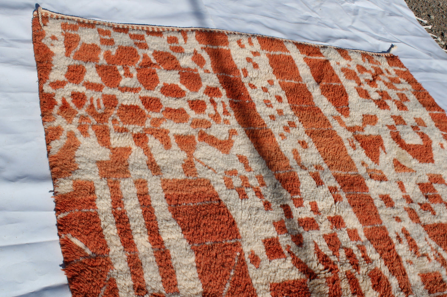 Beni Ourain rugs originate from the Atlas Mountains of Morocco and are characterized by their distinctive, neutral-toned, and geometric designs. These handwoven rugs often feature a plush pile and are made by the Berber tribes,  size is 270x180 cm