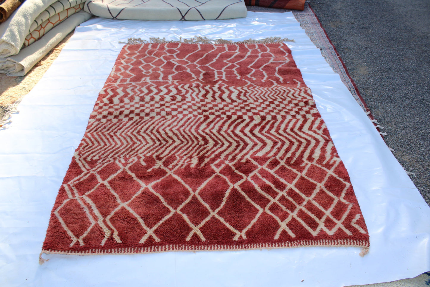 Beni Ourain rugs originate from the Atlas Mountains of Morocco and are characterized by their distinctive, neutral-toned, and geometric designs. These handwoven rugs often feature a plush pile and are made by the Berber tribes,  size is 270x168 cm