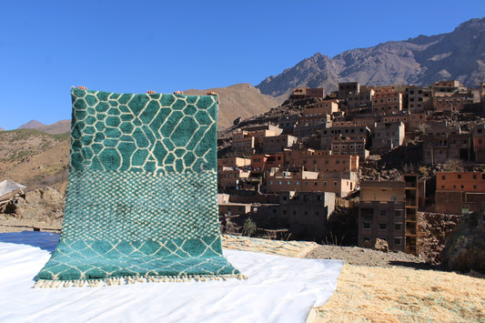 Beni Ourain rugs originate from the Atlas Mountains of Morocco and are characterized by their distinctive, neutral-toned, and geometric designs. These handwoven rugs often feature a plush pile and are made by the Berber tribes,  size is 250x150cm