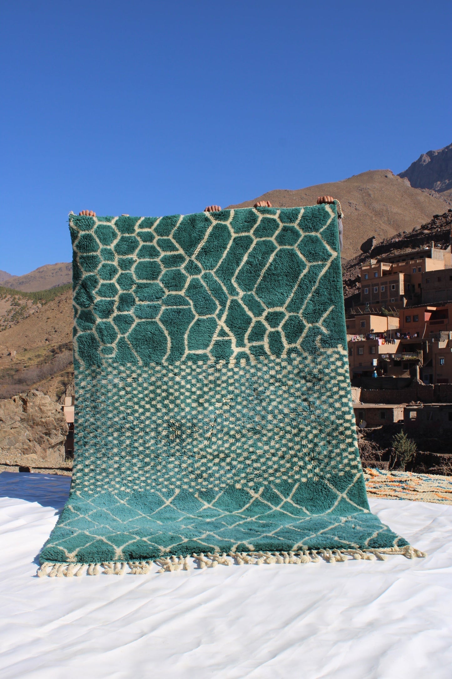 Beni Ourain rugs originate from the Atlas Mountains of Morocco and are characterized by their distinctive, neutral-toned, and geometric designs. These handwoven rugs often feature a plush pile and are made by the Berber tribes,  size is 250x150cm