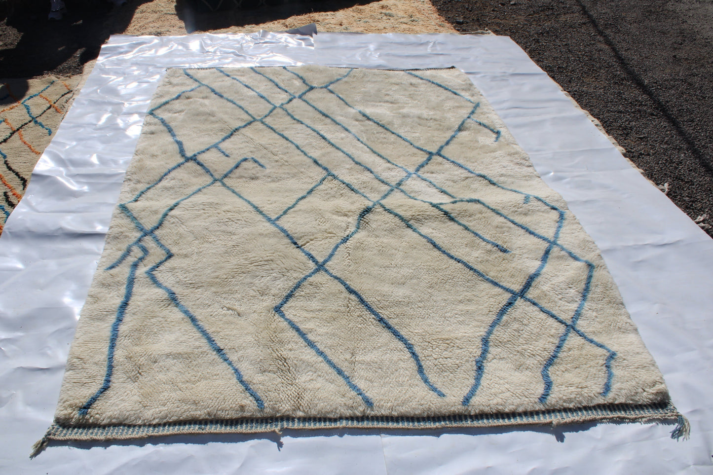 Beni Ourain rugs originate from the Atlas Mountains of Morocco and are characterized by their distinctive, neutral-toned, and geometric designs. These handwoven rugs often feature a plush pile and are made by the Berber tribes,  size is 270x192 cm