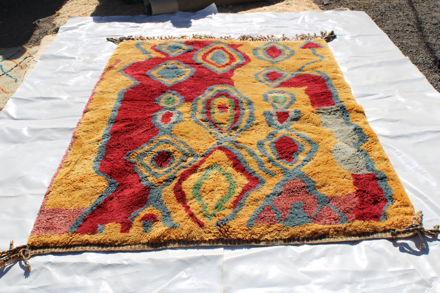 Beni Ourain rugs originate from the Atlas Mountains of Morocco and are characterized by their distinctive, neutral-toned, and geometric designs. These handwoven rugs often feature a plush pile and are made by the Berber tribes,  size is 270x180 cm