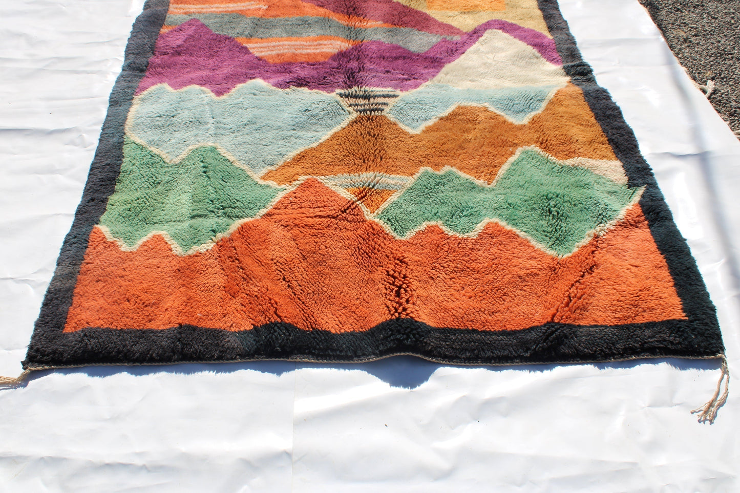 Beni Ourain rugs originate from the Atlas Mountains of Morocco and are characterized by their distinctive, neutral-toned, and geometric designs. These handwoven rugs often feature a plush pile and are made by the Berber tribes,  size is 270x192 cm