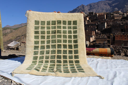 Beni Ourain rugs originate from the Atlas Mountains of Morocco and are characterized by their distinctive, neutral-toned, and geometric designs. These handwoven rugs often feature a plush pile and are made by the Berber tribes,  size is 260x192 cm