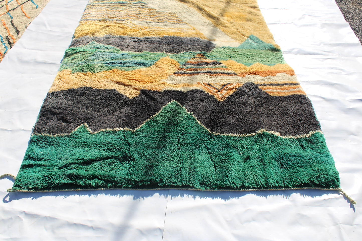 Beni Ourain rugs originate from the Atlas Mountains of Morocco and are characterized by their distinctive, neutral-toned, and geometric designs. These handwoven rugs often feature a plush pile and are made by the Berber tribes,  size is 280x177 cm