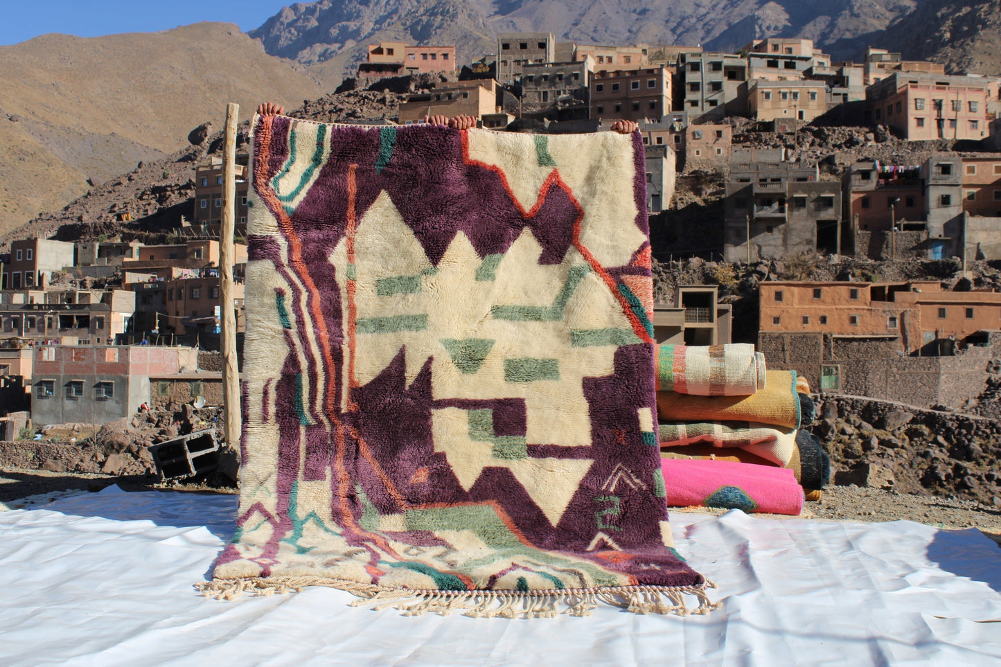 Beni Ourain rugs originate from the Atlas Mountains of Morocco and are characterized by their distinctive, neutral-toned, and geometric designs. These handwoven rugs often feature a plush pile and are made by the Berber tribes,  size is 224x160 cm