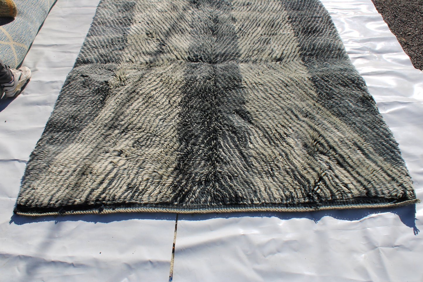 Beni Ourain rugs originate from the Atlas Mountains of Morocco and are characterized by their distinctive, neutral-toned, and geometric designs. These handwoven rugs often feature a plush pile and are made by the Berber tribes,  size is 254x190 cm