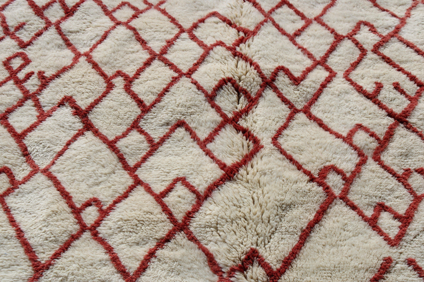 Beni Ourain rugs originate from the Atlas Mountains of Morocco and are characterized by their distinctive, neutral-toned, and geometric designs. These handwoven rugs often feature a plush pile and are made by the Berber tribes,  size is 280x177 cm