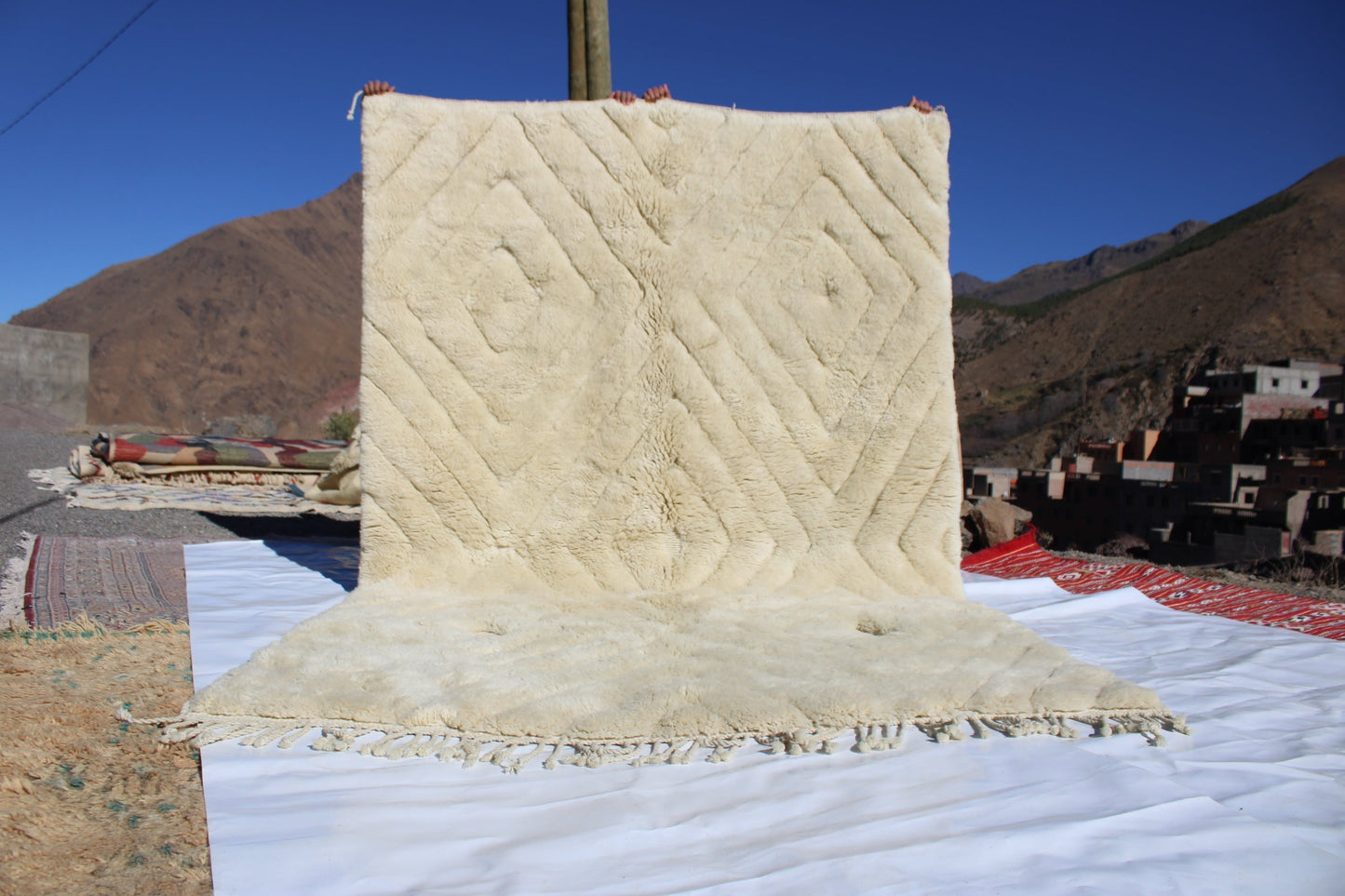 Beni Ourain rugs originate from the Atlas Mountains of Morocco and are characterized by their distinctive, neutral-toned, and geometric designs. These handwoven rugs often feature a plush pile and are made by the Berber tribes,  size is 280x177 cm