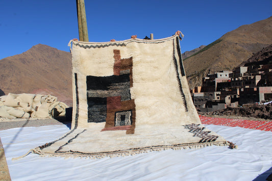 Beni Ourain rugs originate from the Atlas Mountains of Morocco and are characterized by their distinctive, neutral-toned, and geometric designs. These handwoven rugs often feature a plush pile and are made by the Berber tribes,  size is 280x177 cm