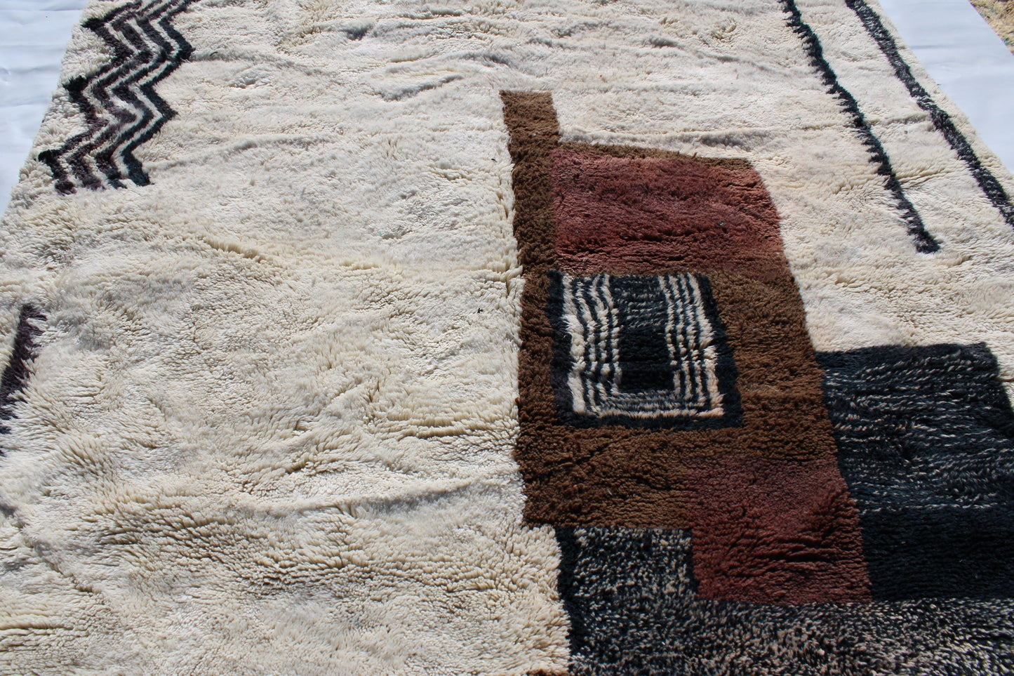 Beni Ourain rugs originate from the Atlas Mountains of Morocco and are characterized by their distinctive, neutral-toned, and geometric designs. These handwoven rugs often feature a plush pile and are made by the Berber tribes,  size is 280x177 cm