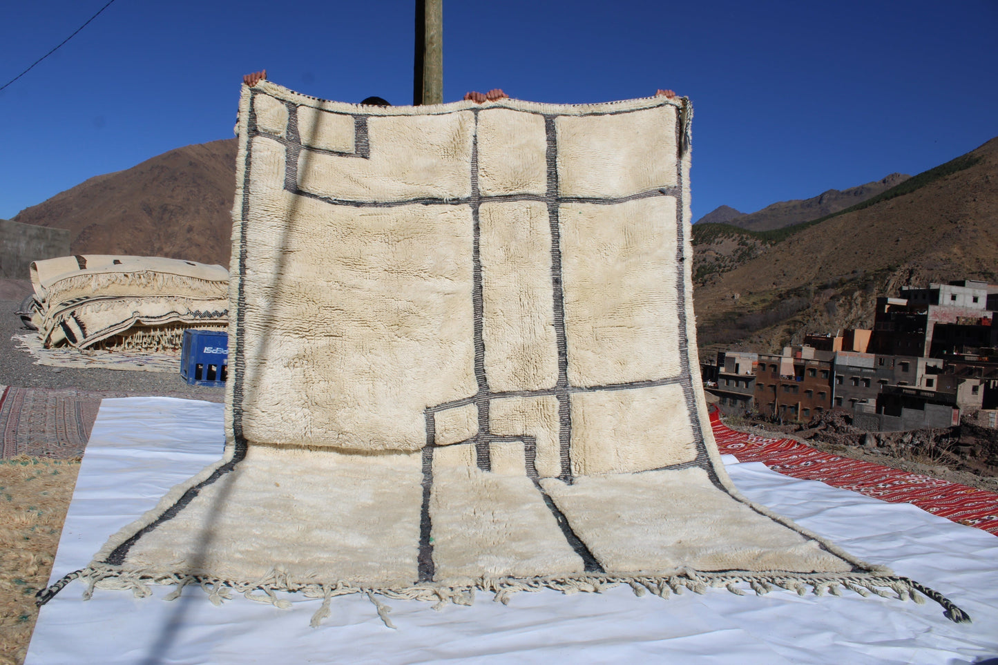 Beni Ourain rugs originate from the Atlas Mountains of Morocco and are characterized by their distinctive, neutral-toned, and geometric designs. These handwoven rugs often feature a plush pile and are made by the Berber tribes,  size is 280x177 cm