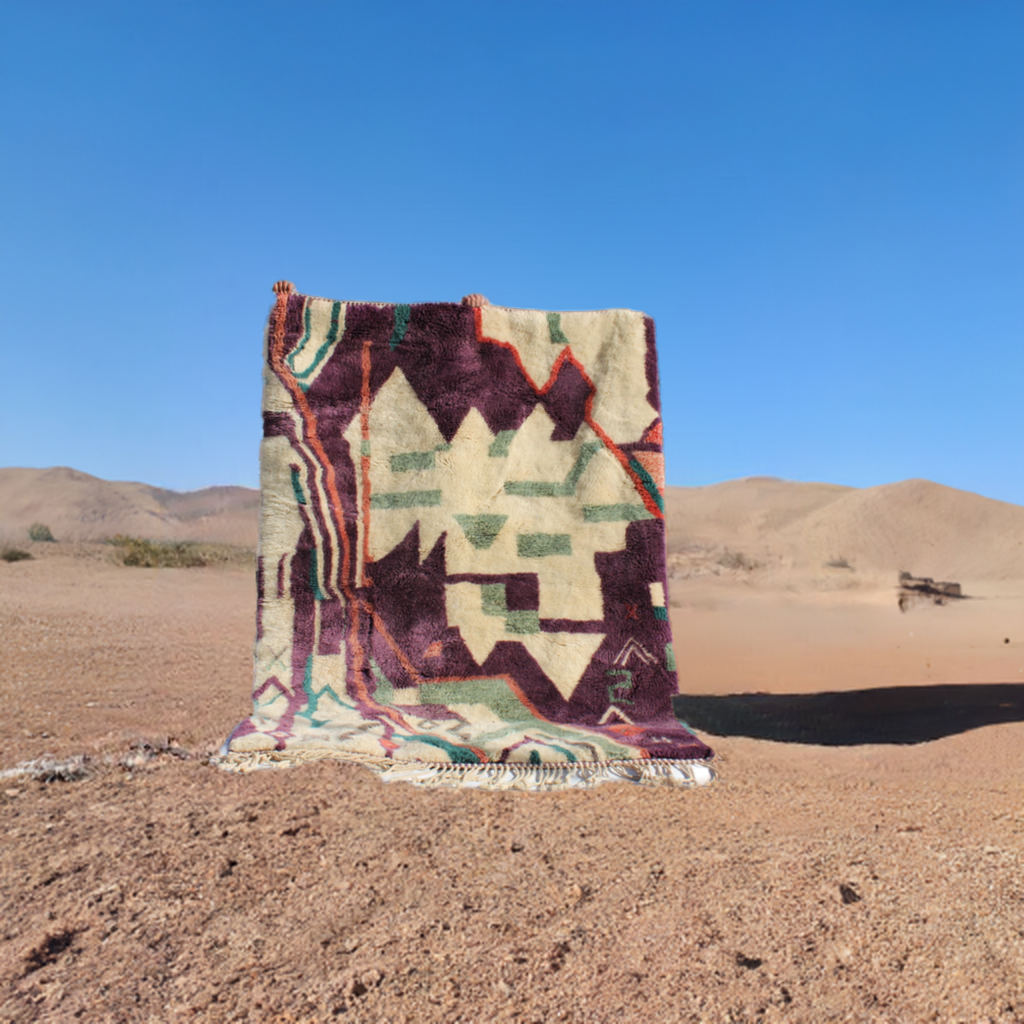 Beni Ourain rugs originate from the Atlas Mountains of Morocco and are characterized by their distinctive, neutral-toned, and geometric designs. These handwoven rugs often feature a plush pile and are made by the Berber tribes,  size is 224x160 cm